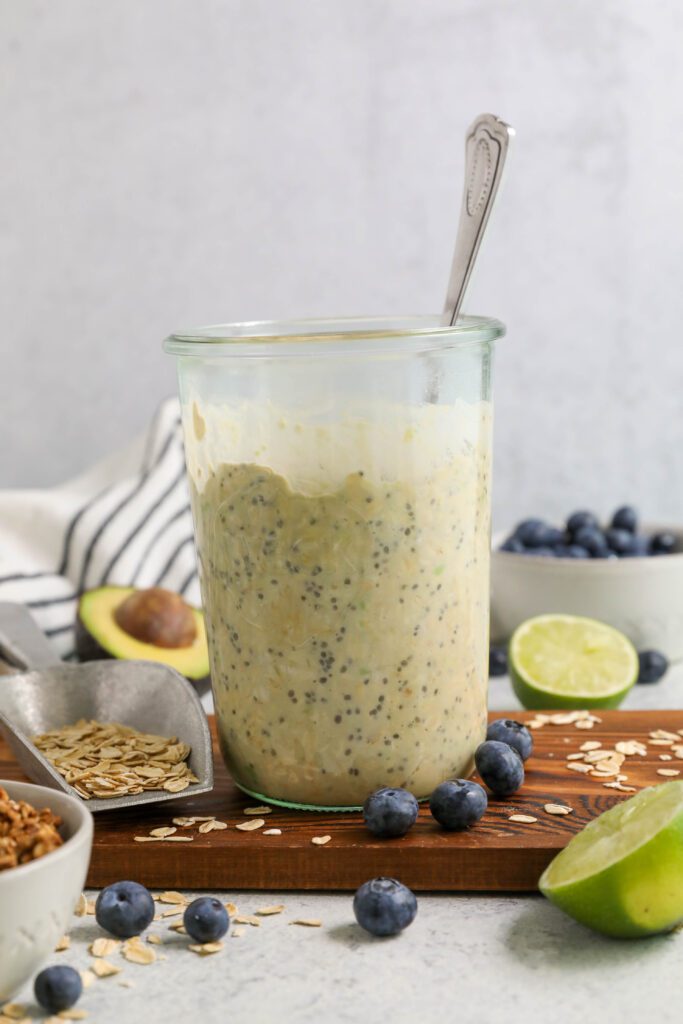 Key Lime Pie Overnight Oats mixed in mason jar by Flora & Vino