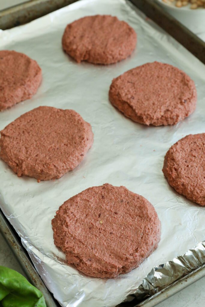 Smoky White Bean & Beet Burger formed on aluminum lined baking sheet