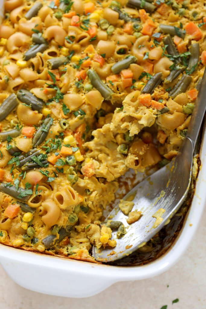 Chickpea Macaroni Casserole with serving spoon by Flora & Vino