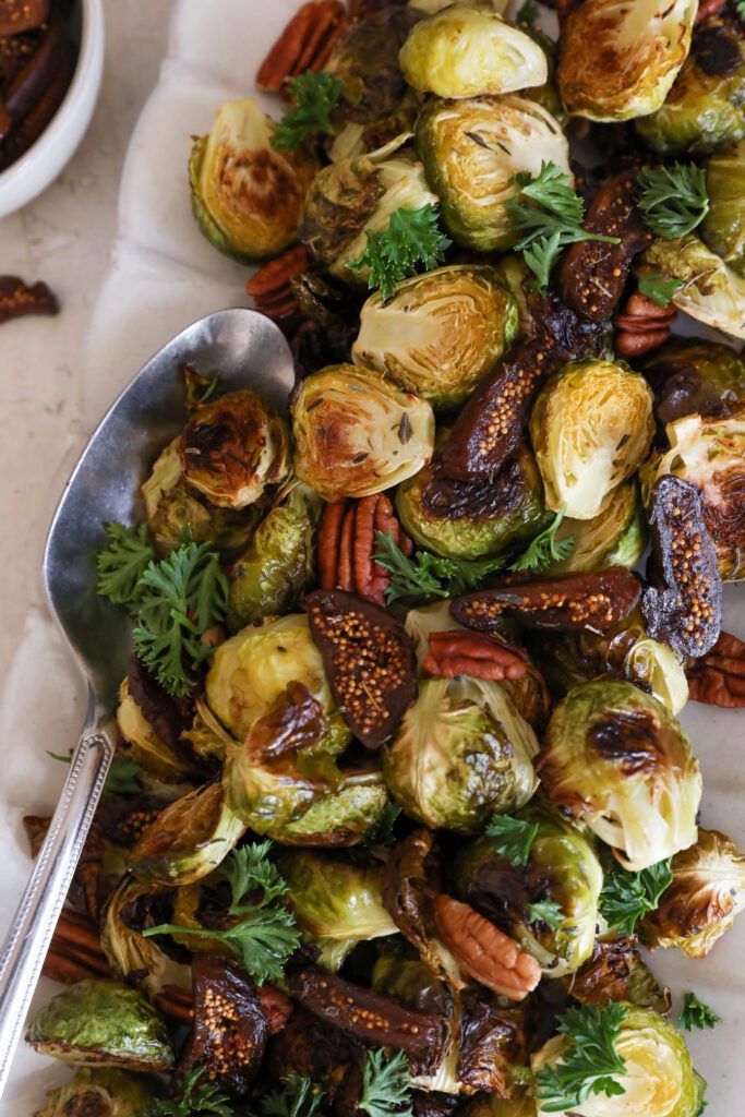 Roasted Brussels Sprouts with Figs & Pecans with fresh parsley by Flora & Vino