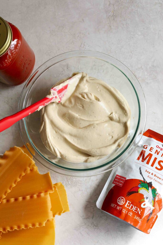 Tofu Ricotta in mixing bowl with spatula by Flora & Vino