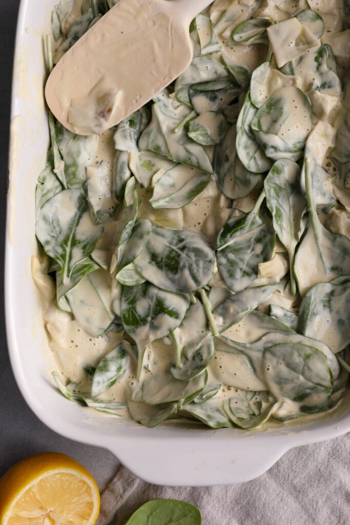Spinach Artichoke Cashew Dip in casserole dish by Flora & Vino