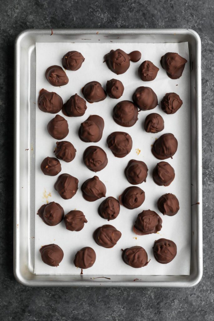 Vegan SunButter Date Caramels dipped in chocolate by Flora & Vino