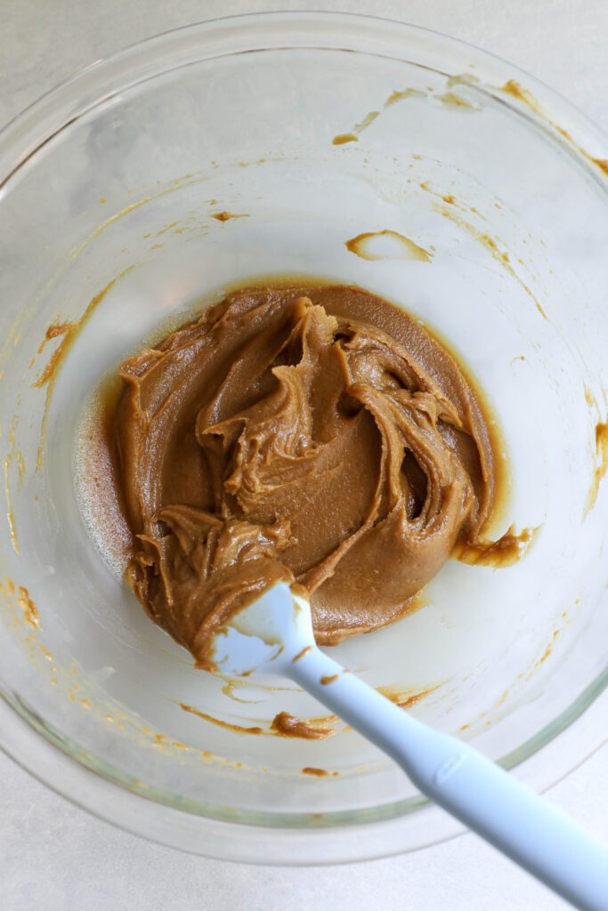 SunButter Chocolate Chip Protein Bars process photo in a bowl with a spatula by Flora & Vino