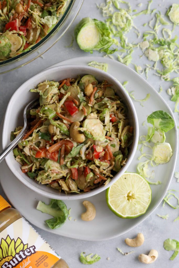 Raw Brussels Sprouts Salad with SunButter Dressing by Flora & Vino