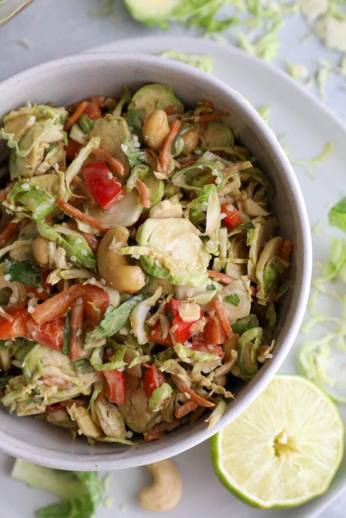 Raw Brussels Sprouts Salad with SunButter Dressing by Flora & Vino