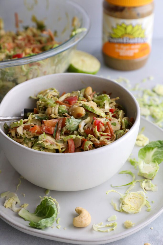 Raw Brussels Sprouts Salad with SunButter Dressing by Flora & Vino