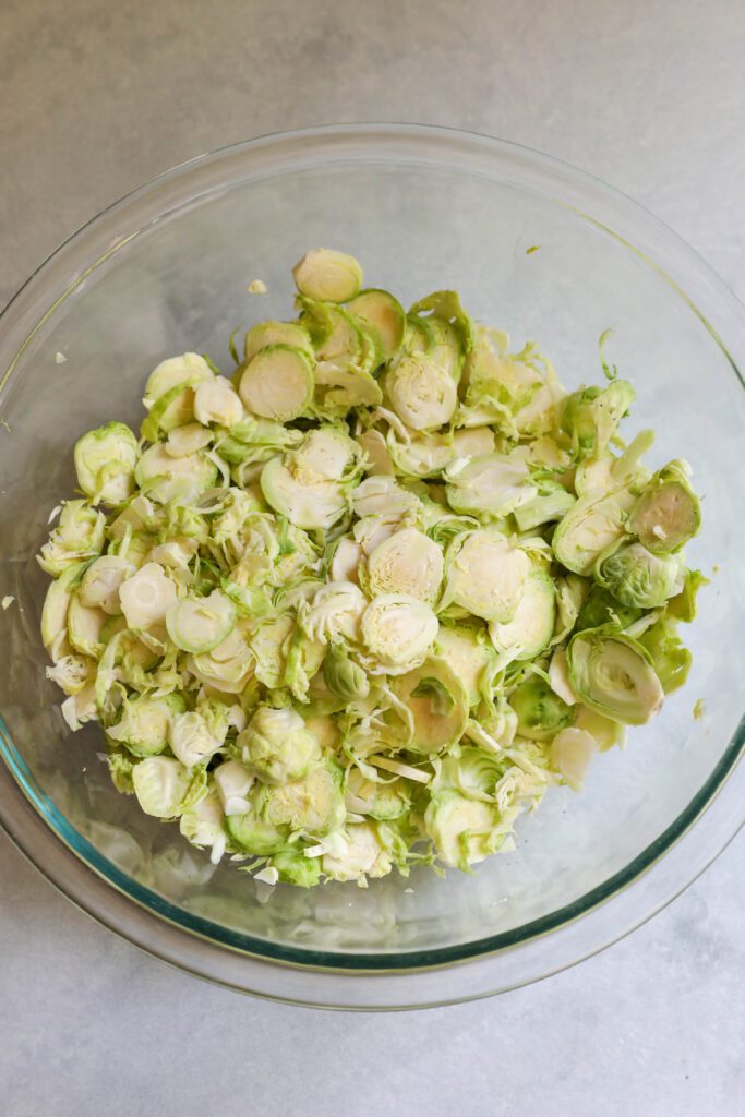 Raw Brussels Sprouts Salad with SunButter Dressing process photo by Flora & Vino
