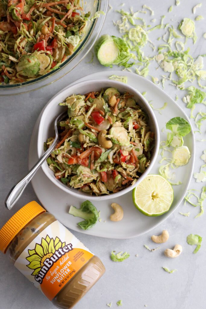 Raw Brussels Sprouts Salad with SunButter Dressing by Flora & Vino