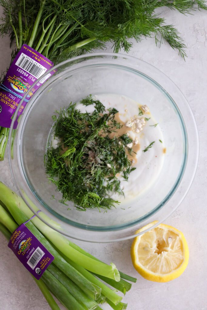 ingredients for yogurt dill sauce in bowl 