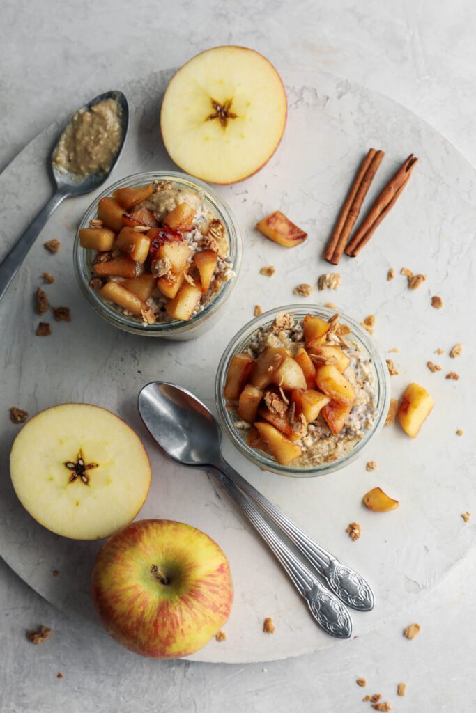 Apple Pie Overnight Oats in mason jars with granola and walnut butter by Flora & Vino
