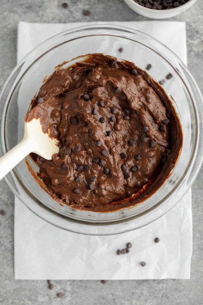 brownies mixed in bowl with chocolate chips and spatula by Flora & Vino 