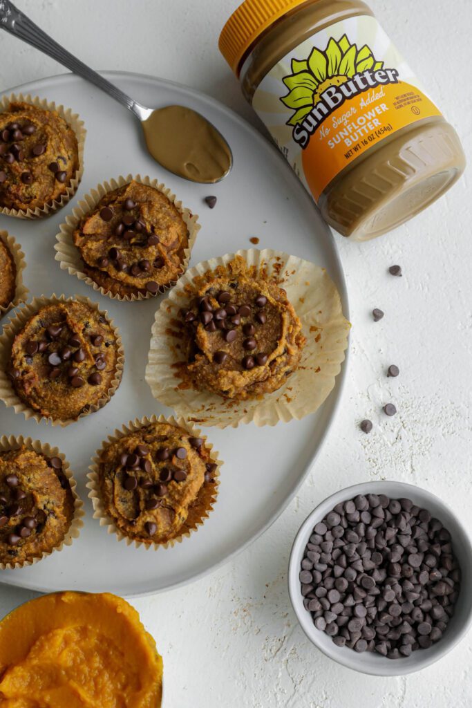 Pumpkin SunButter Chocolate Chip Muffins served on plate by Flora & Vino