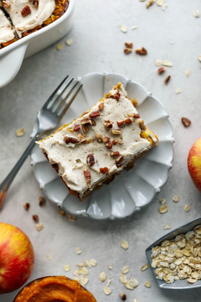 Pumpkin Apple Baked Oats sliced on plate with fork Flora & Vino