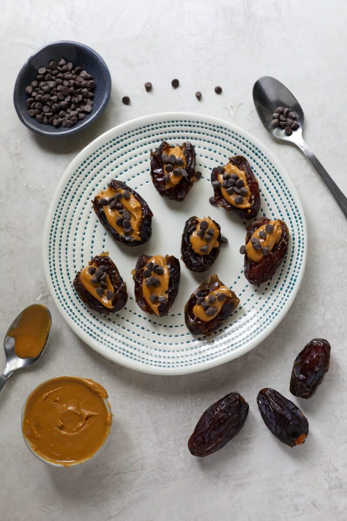 Peanut Butter Stuffed Dates served on plate by Flora & Vino