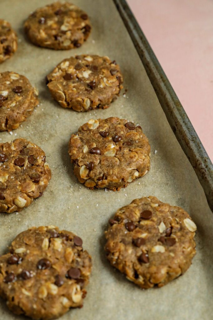 Peanut Butter Chocolate Chip Oatmeal Cookies baked on baking sheet by Flora & Vino