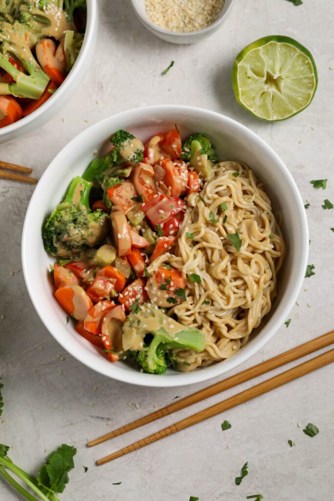 SunButter Ramen Noodle Bowls served in a bowl with cilantro and sesame seeds and chopsticks by Flora & Vino