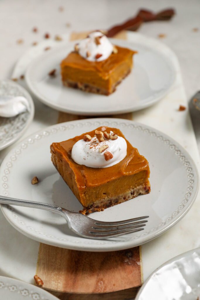 Sweet Potato Pie Bars on plates with forks by Flora & Vino