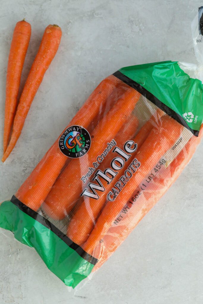 Grimmway Farms Bagged Carrots on white board by Flora & Vino
