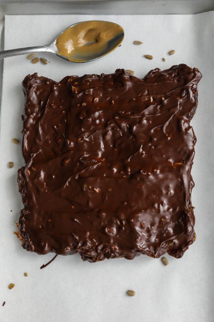 Viral Date Bark (Nut-Free!) setting on parchment lined baking sheet by Flora & Vino 