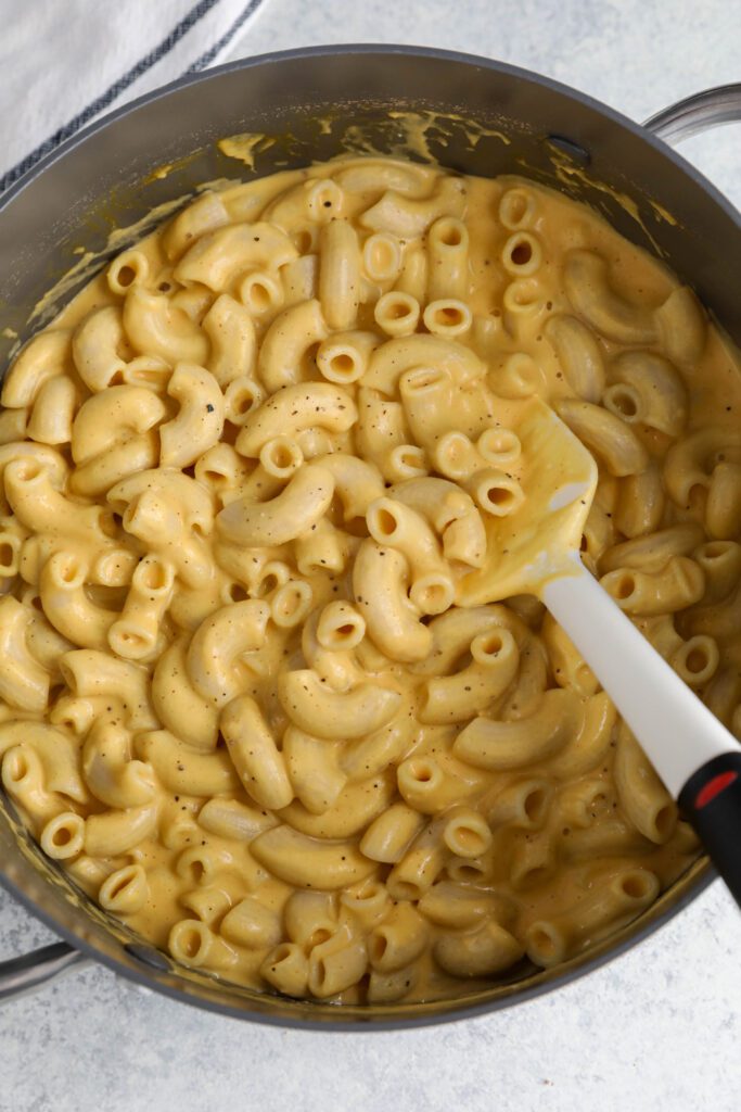 Butternut Squash Mac 'N' Cheese in pot with spatula
