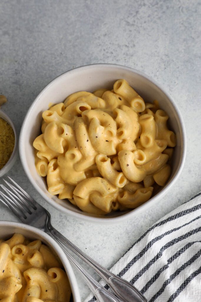 Butternut Squash Mac 'N' Cheese served in bowl with forks on side