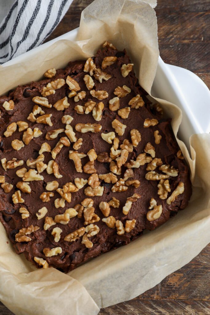Red Bean Brownie batter in baking dish topped with walnuts 