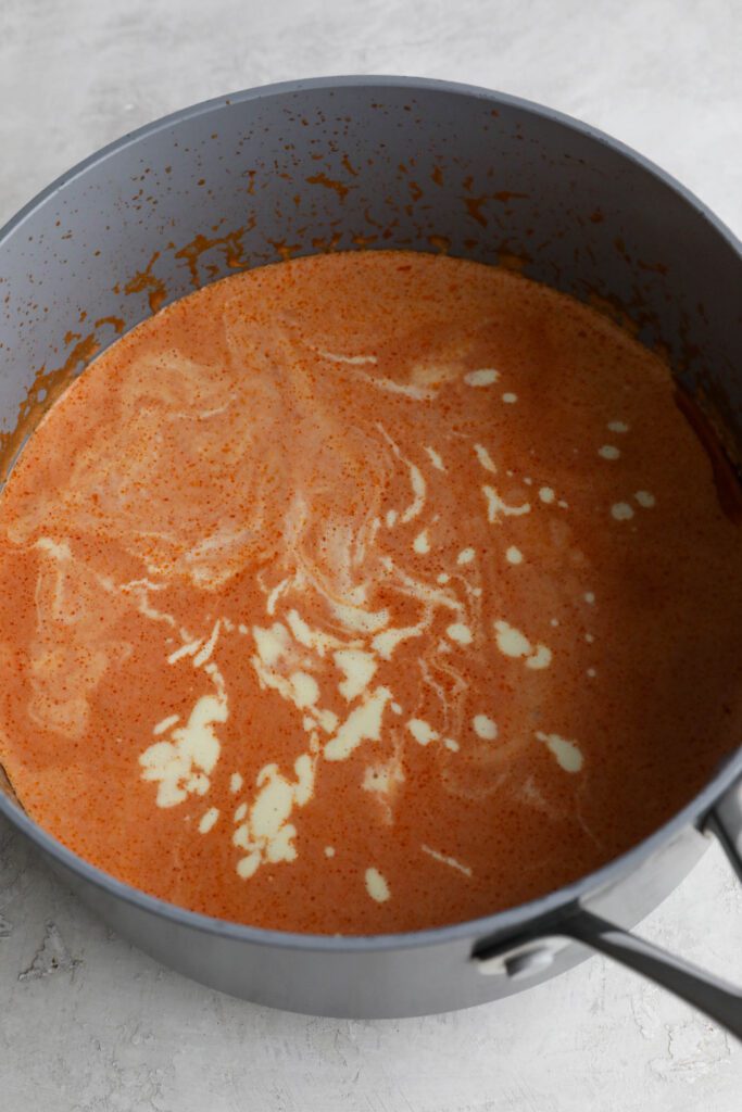 pink pasta sauce in pot 