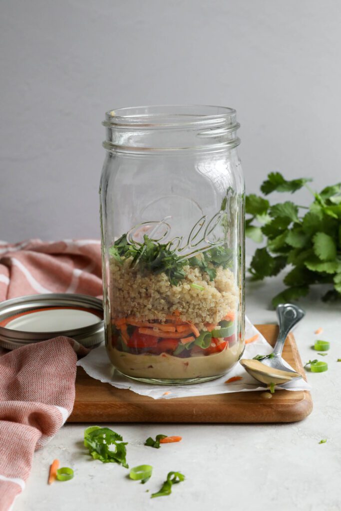 Thai Mason Jar Salad on board with cilantro in background 