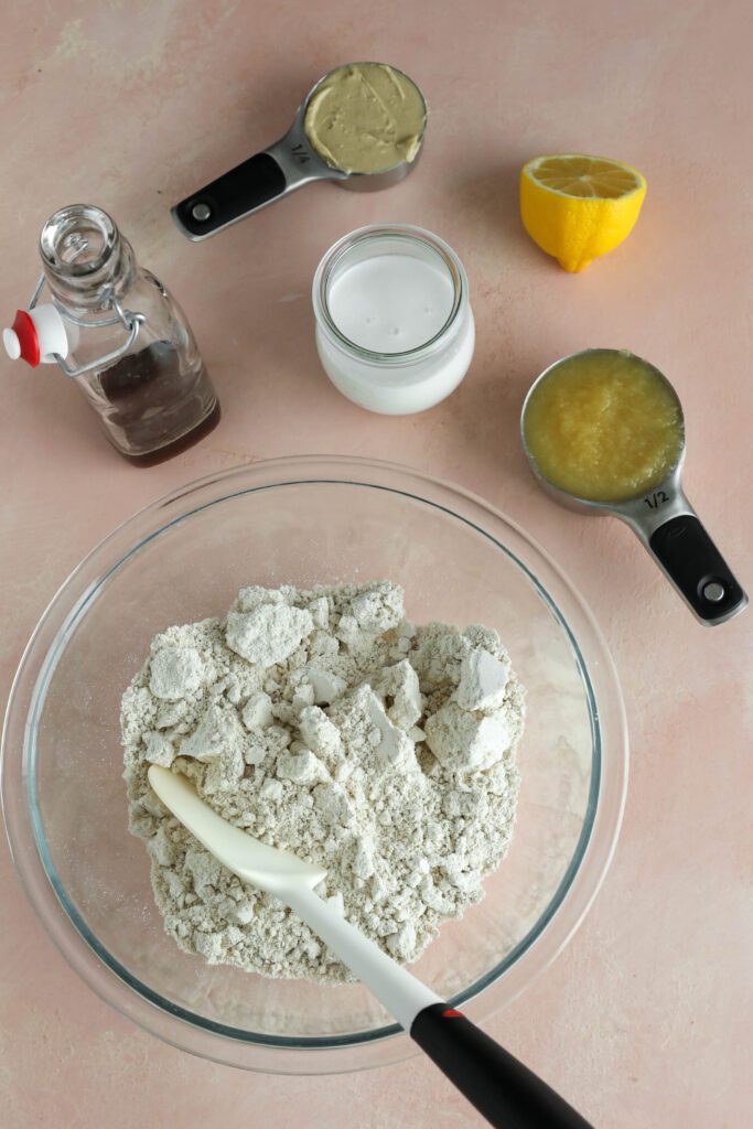 ingredients for applesauce waffles on pink board 