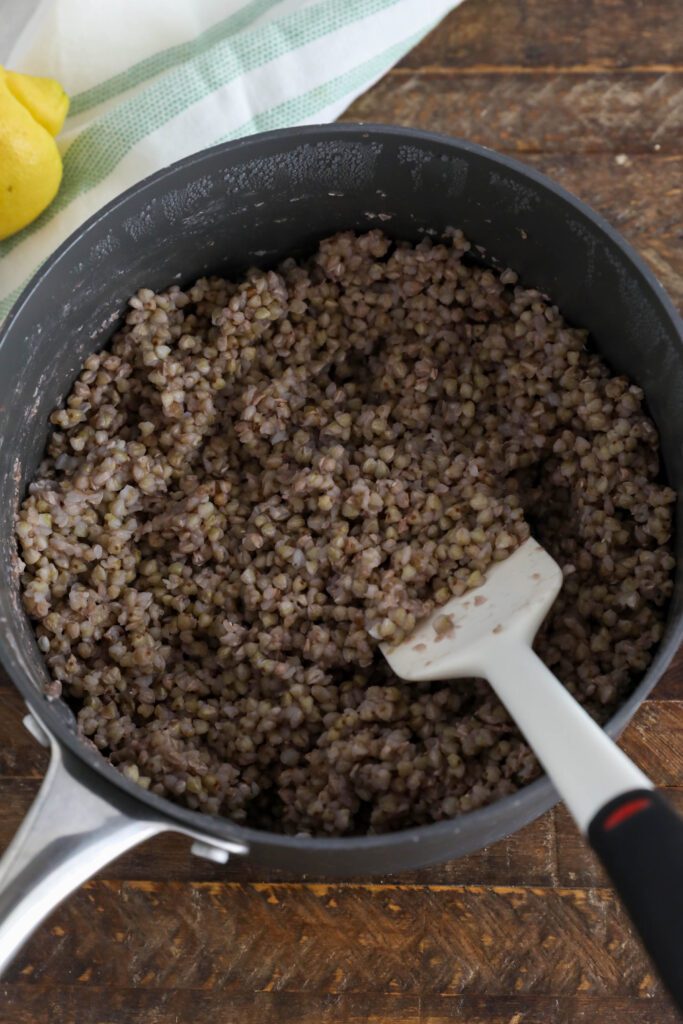 buckwheat cooked in pot with spatula