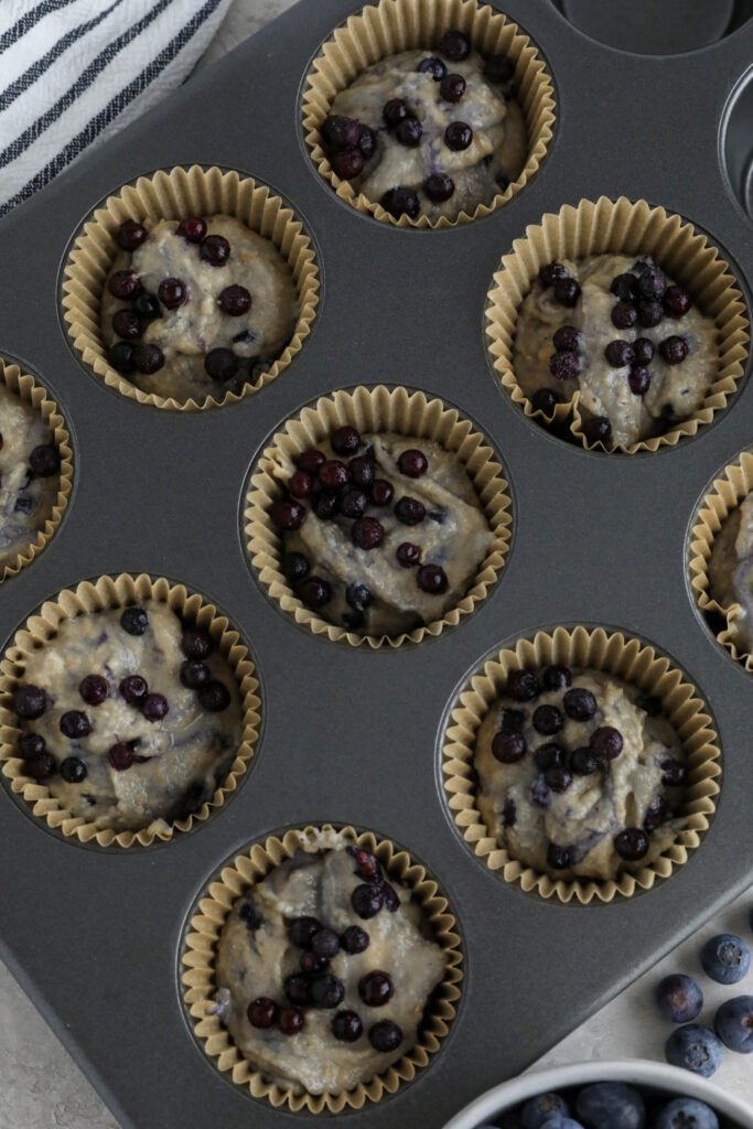 Vegan Blueberry Muffins in muffin tin 