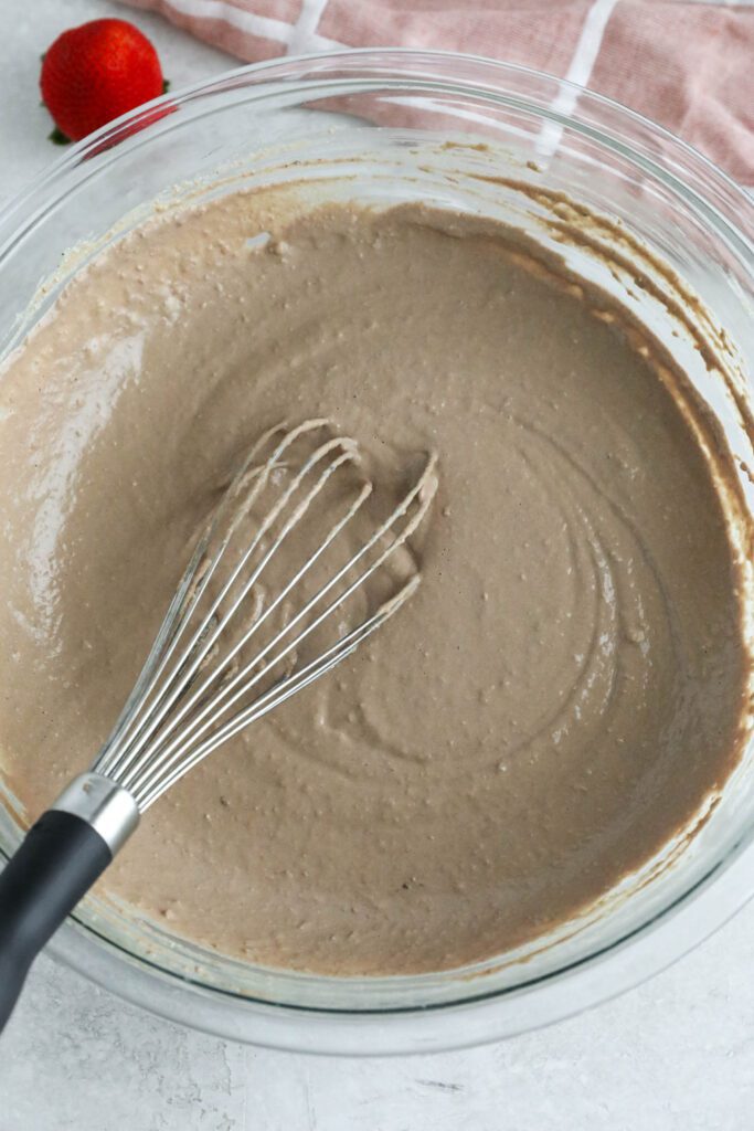 Vegan Chocolate Waffle batter in bowl with whisker