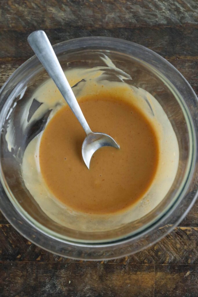 sriracha may in bowl with spoon 