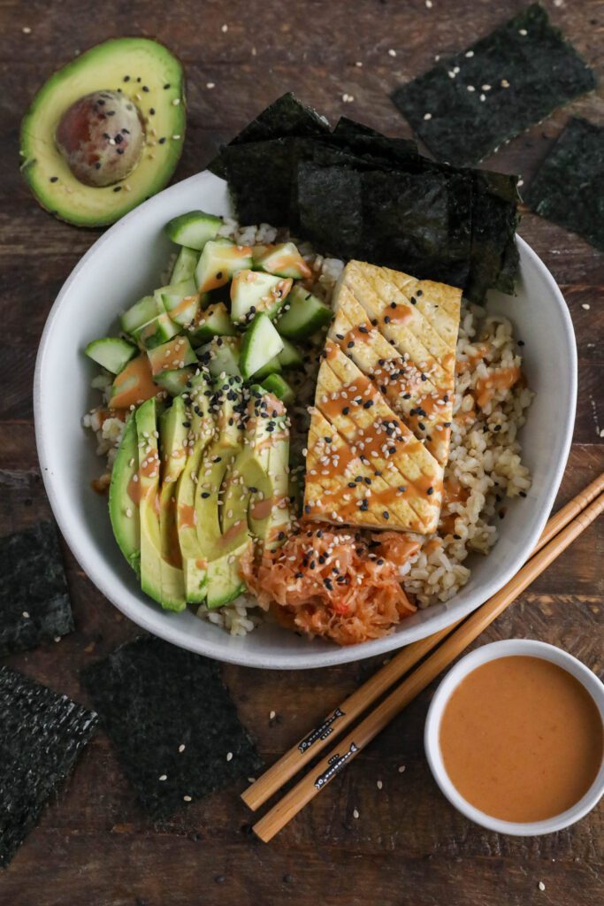 Vegan Viral "Salmon" Bowl served in a bowl with chopsticks and black and white sesame seeds