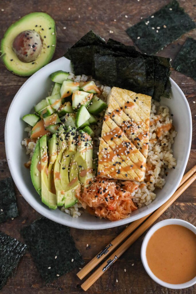 Vegan Viral "Salmon" Bowl served in a bowl with chopsticks and black and white sesame seeds