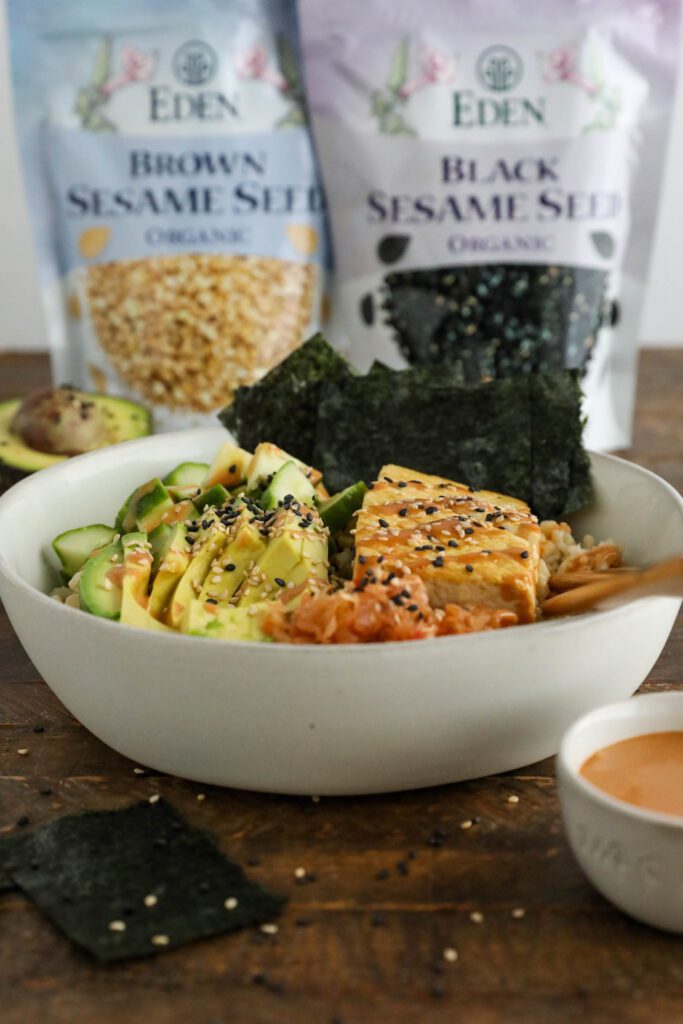 Vegan Viral "Salmon" Bowl served in a bowl with chopsticks and black and white sesame seeds