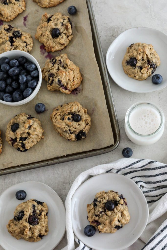 Blueberry SunButter Breakfast Cookies baked on parchment lined baking sheet and served on plates 