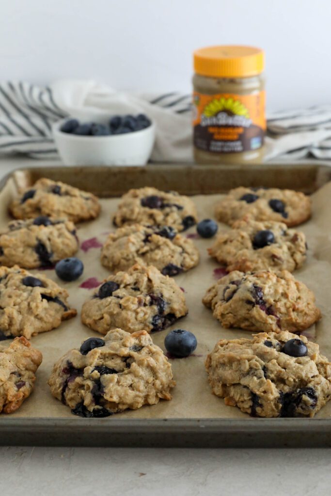 Blueberry SunButter Breakfast Cookies baked on parchment lined baking sheet 