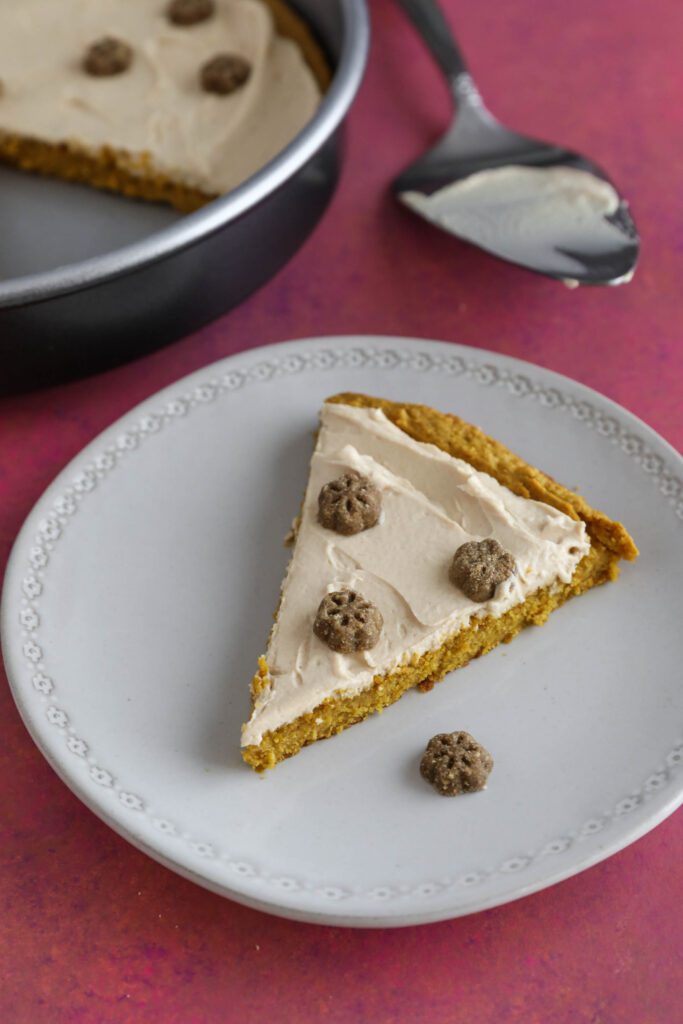 dog cake plated with treats on top 
