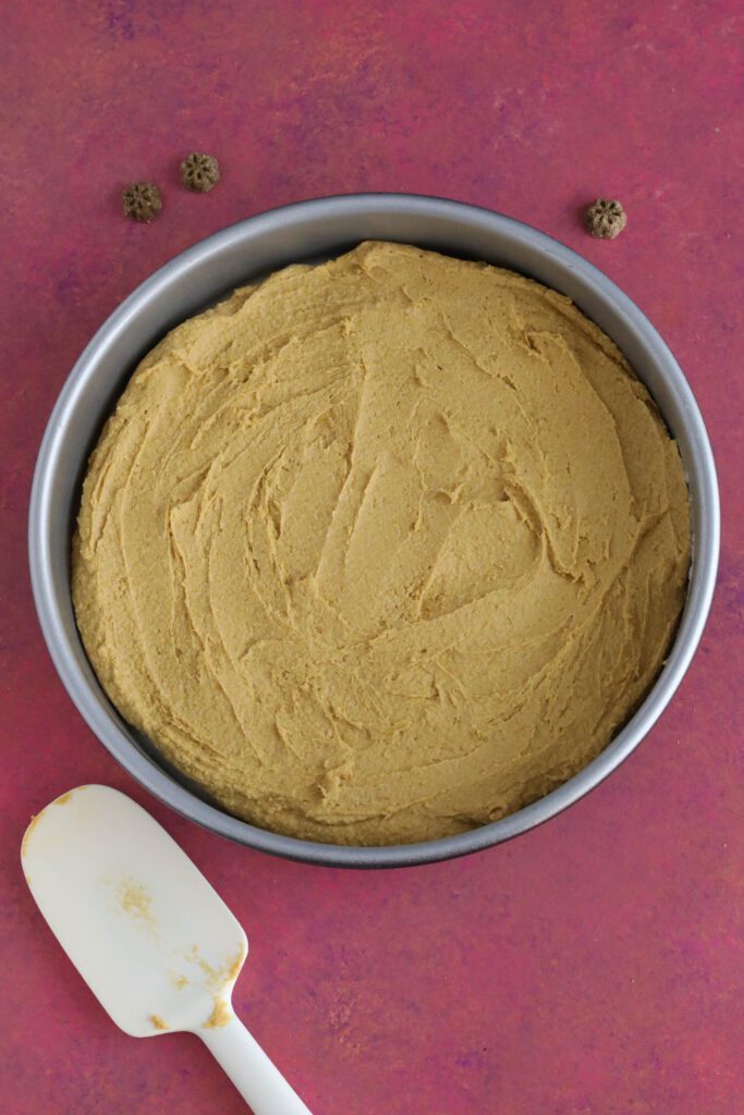 Doggie Birthday Cake in cake pan with dog treats scattered