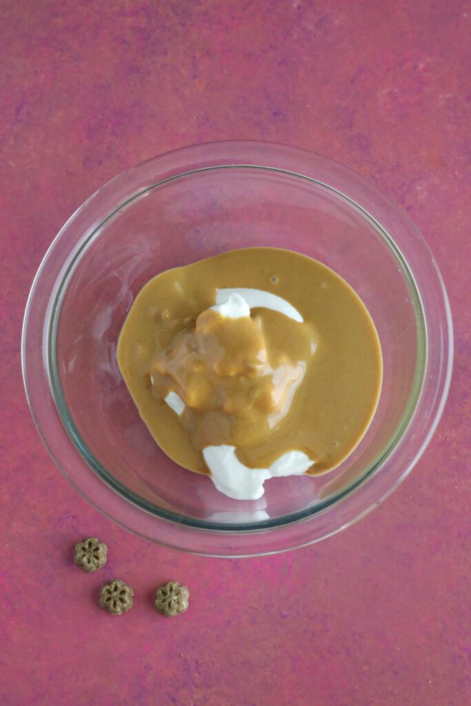 ingredients for dog cake frosting in bowl 