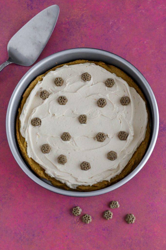 Doggie Birthday Cake in cake pan with dog treats scattered