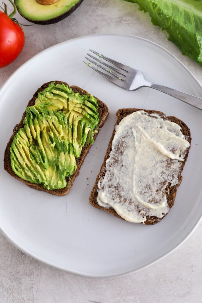 toasted bread topped with avocado and vegan cheese