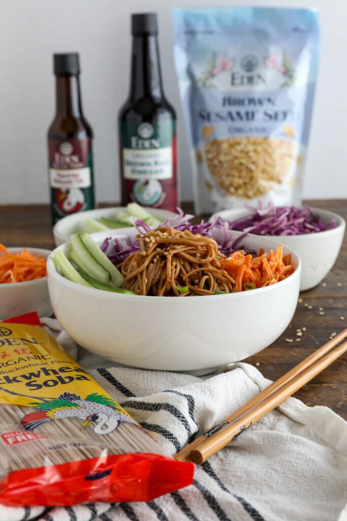 Vegan Bibim Guksu (Korean Spicy Cold Noodles) served in bowl with chopsticks