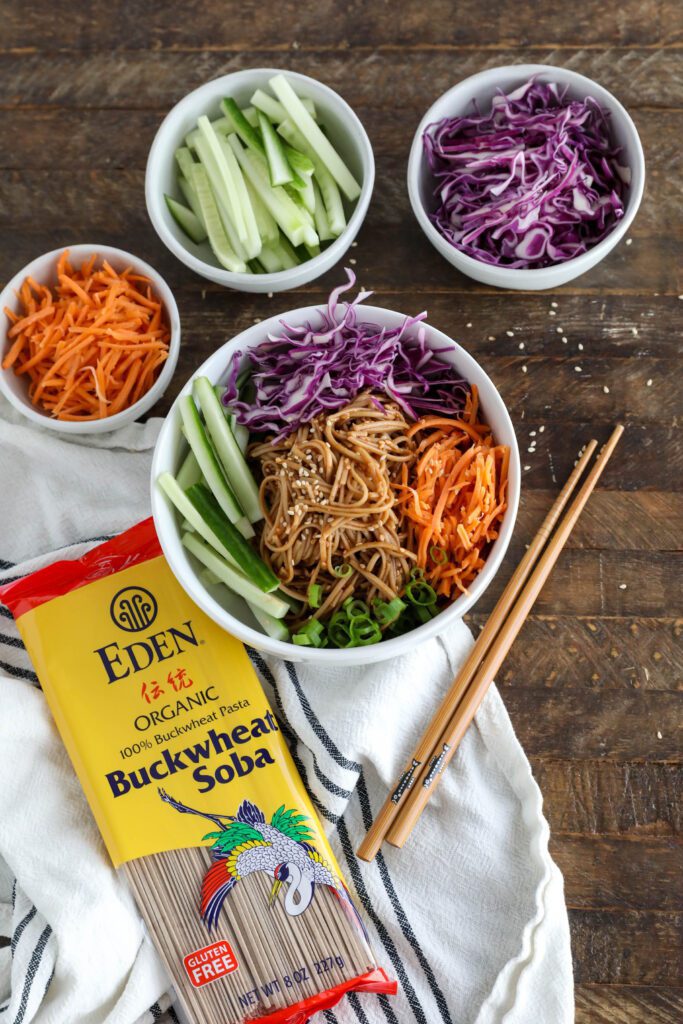 Vegan Bibim Guksu (Korean Spicy Cold Noodles) served in bowl with chopsticks