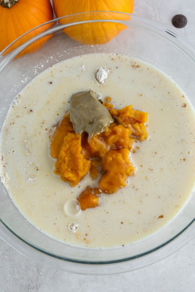 dry and wet ingredients for pumpkin turmeric waffles in bowl 