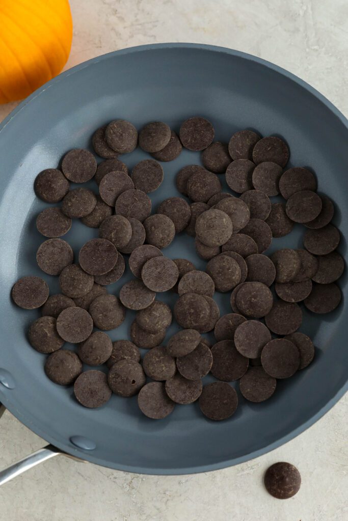 cacao wafers in pan next to pumpkin