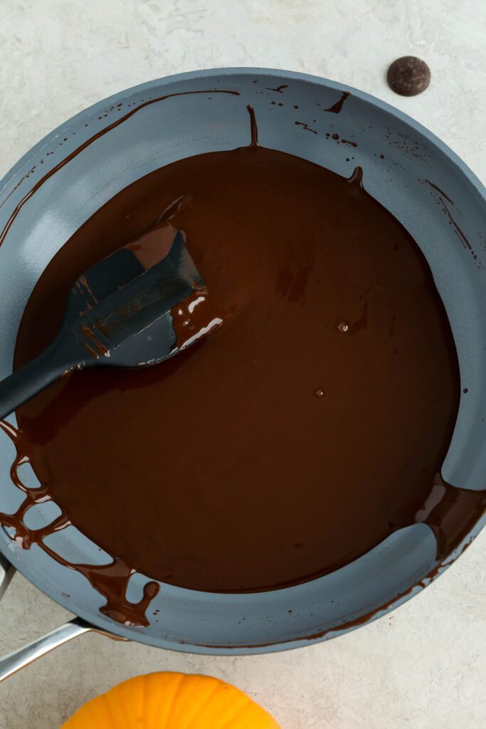 cacao wafers melted in pan with spatula