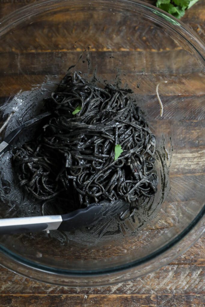 Soba noodles mixed in black sesame butter sauce